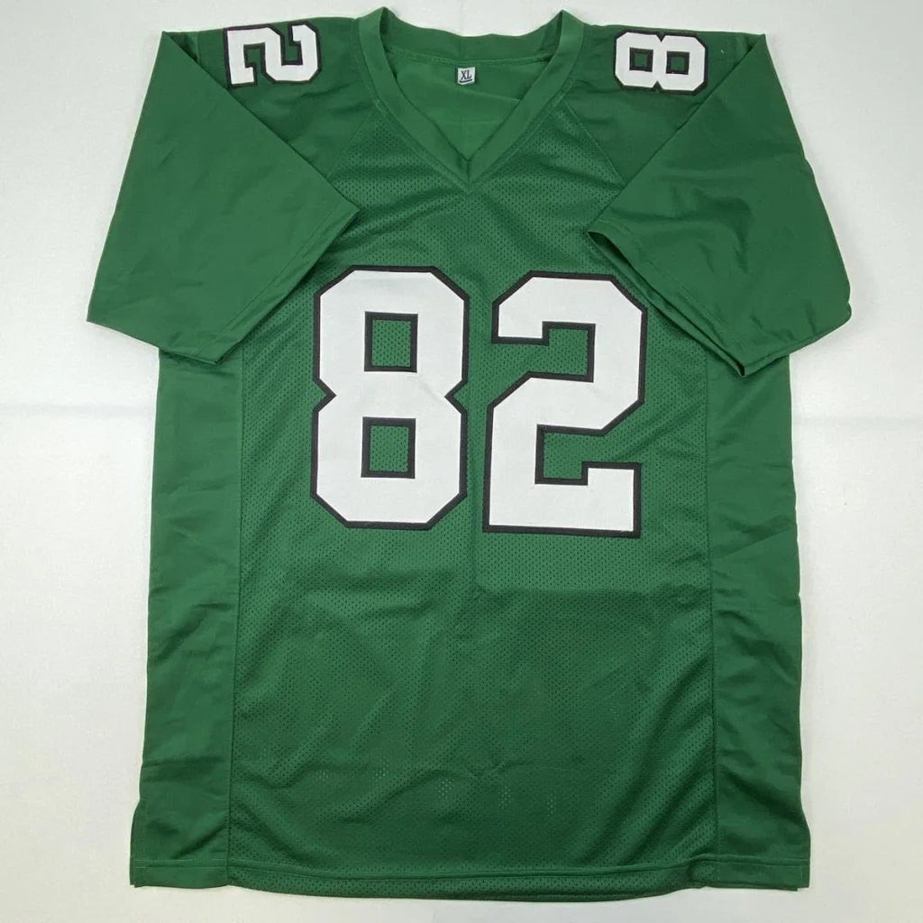 Green mesh custom jersey with white number 82 and v-neck collar for professional sports league signed by mike quick