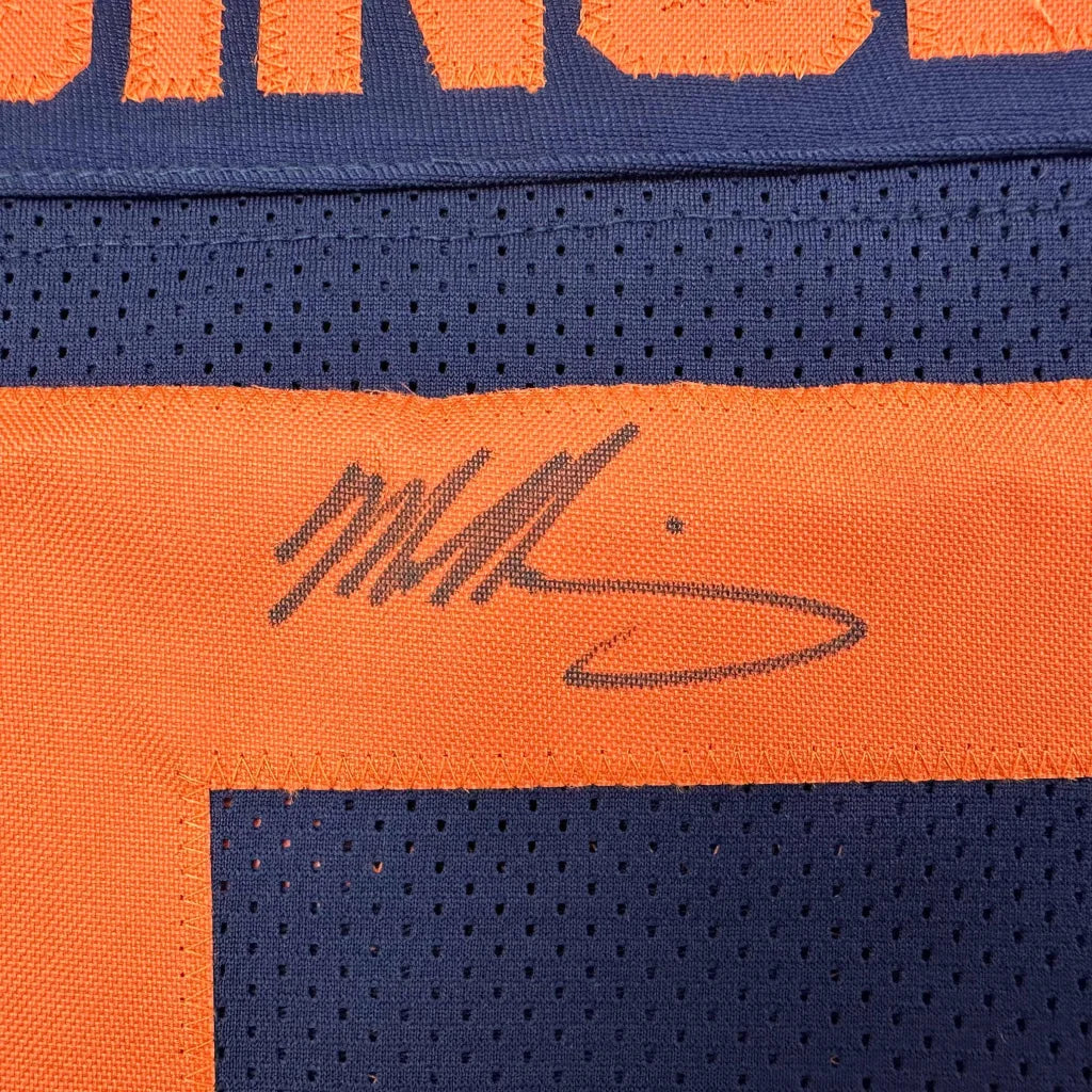 Autographed orange and navy blue custom jersey from a professional sports league collectible