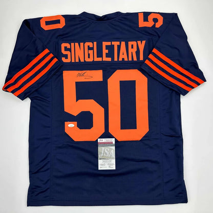 Navy blue custom jersey with orange numbers and stripes from a professional sports league
