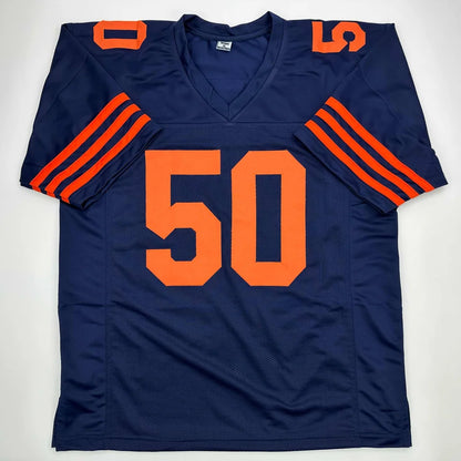 Navy blue custom jersey with orange numbers and stripes from a pro sports league collectible