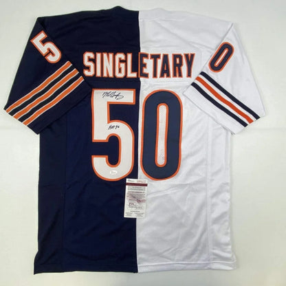 Back of a navy blue and white split custom jersey with orange trim featuring singletary 50 for professional sports league fans