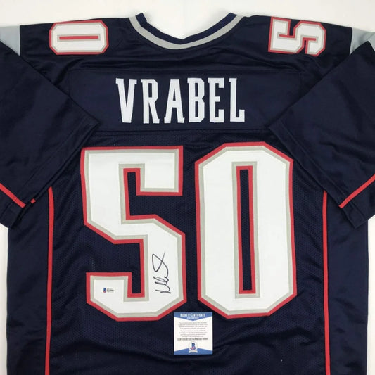 Navy blue autographed Mike Vrabel New England Patriots custom jersey with white and red lettering number 50 from professional sports league