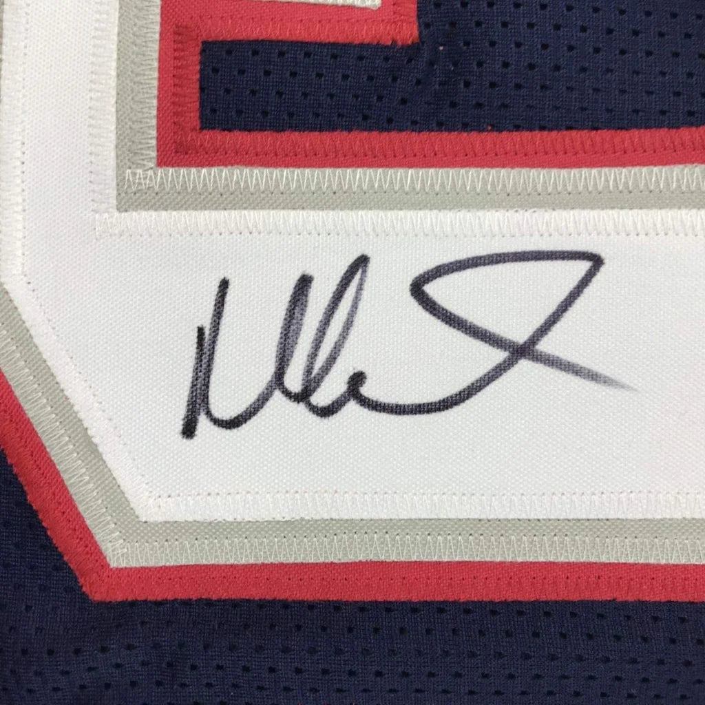 Black ink signature on white fabric patch with red and gray stitching on custom Mike Vrabel professional sports jersey