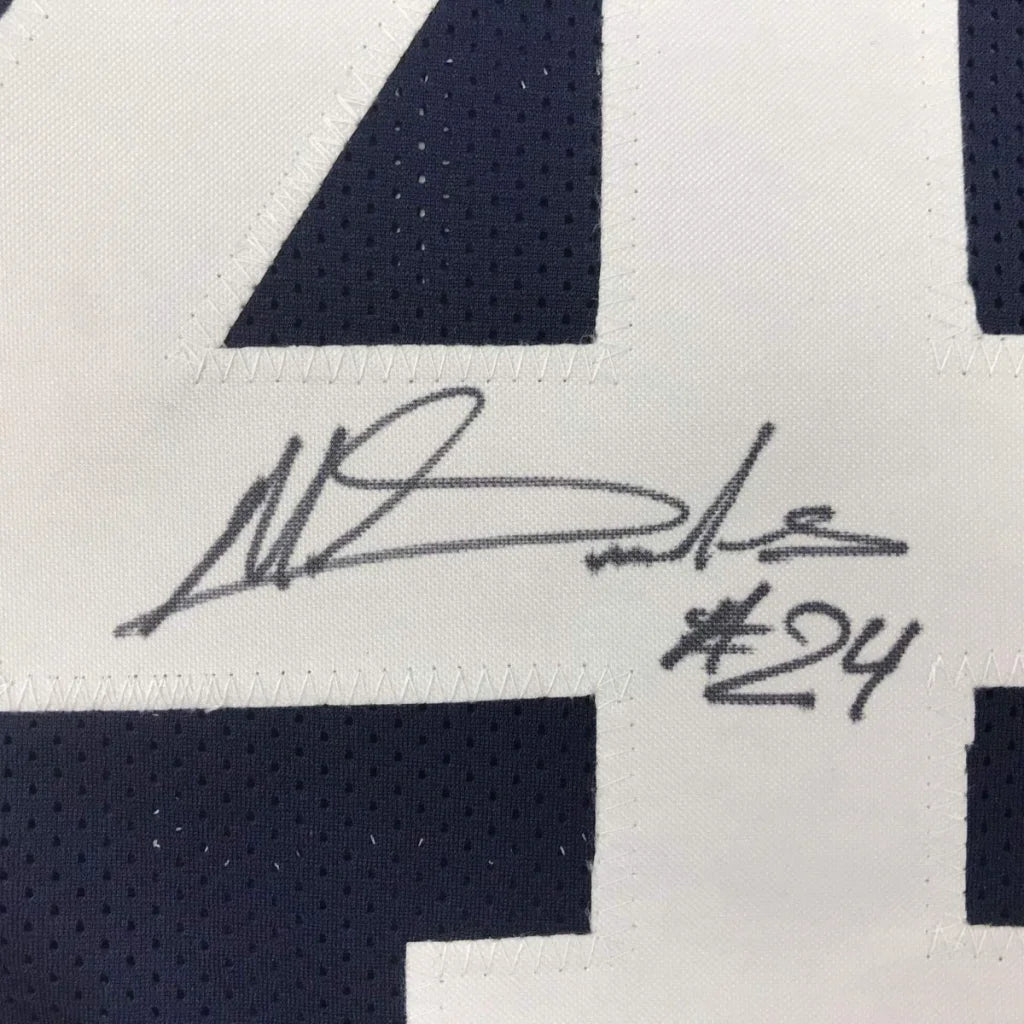Autographed navy blue and white custom basketball jersey with stitched number 24 and signature for professional sports league fans