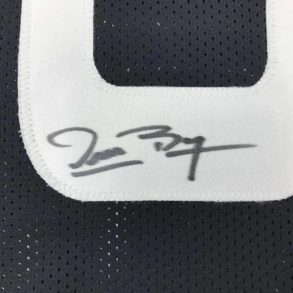 Dark gray custom jersey with white number and signature from Space Jam Monstars