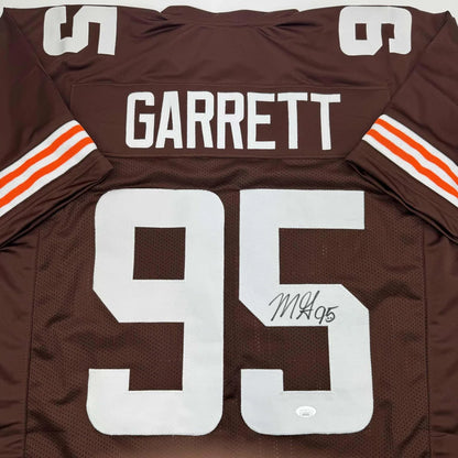 Brown American football jersey with white numbers and name from professional sports league