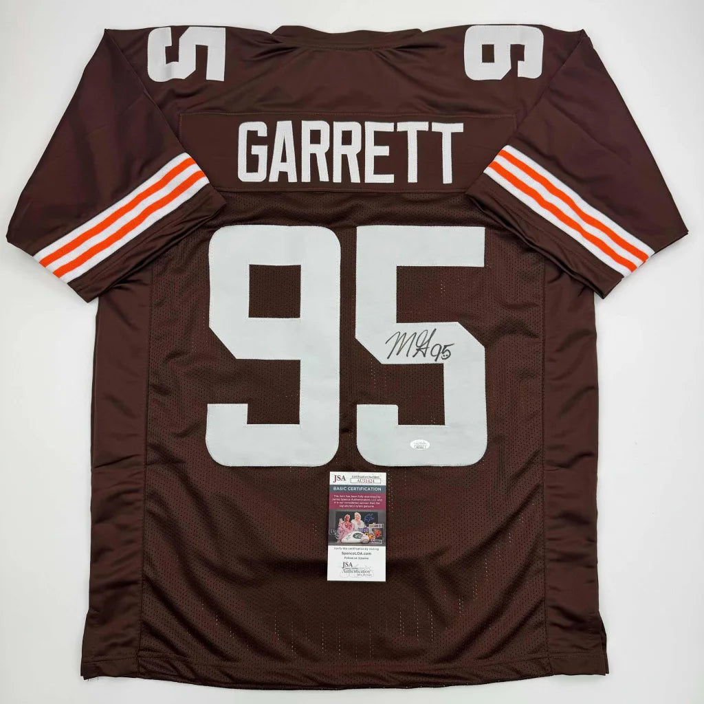 Autographed Myles Garrett Browns jersey with signature, perfect for pro sports fans
