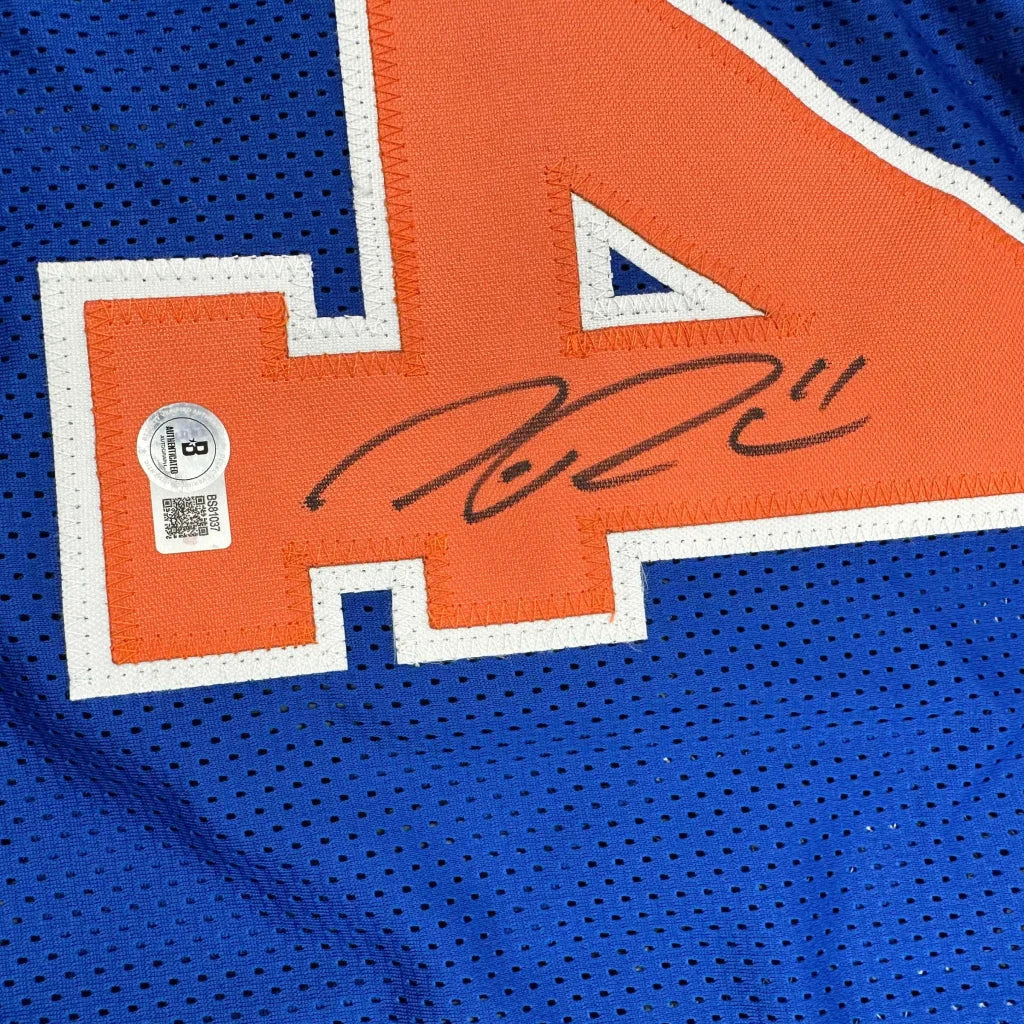 Blue custom jersey with orange number 4 and autograph, perfect for sports league fans
