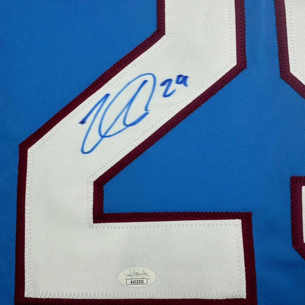 Autographed Nathan MacKinnon custom jersey from professional sports league with authentication sticker