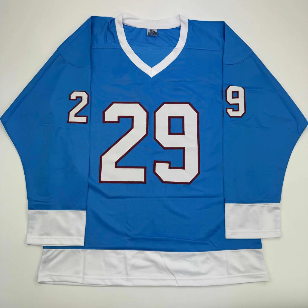 Light blue custom hockey jersey with white trim and number 29 from professional sports league
