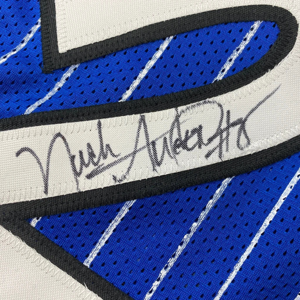 Autographed blue and white Anderson 25 Jersey with third party authentication for authenticity