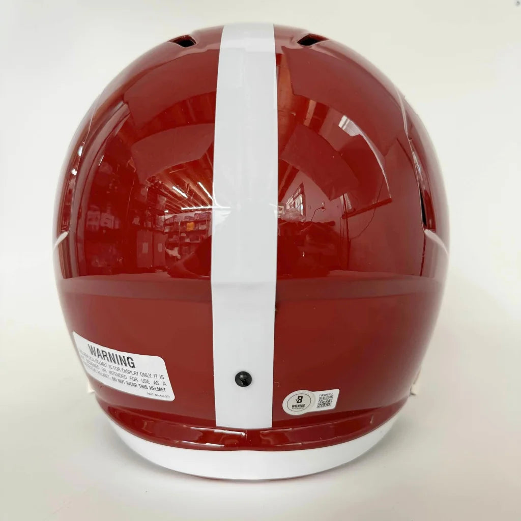 Glossy crimson riddell football helmet with white stripe autographed by Nick Saban for Alabama Crimson Tide fans