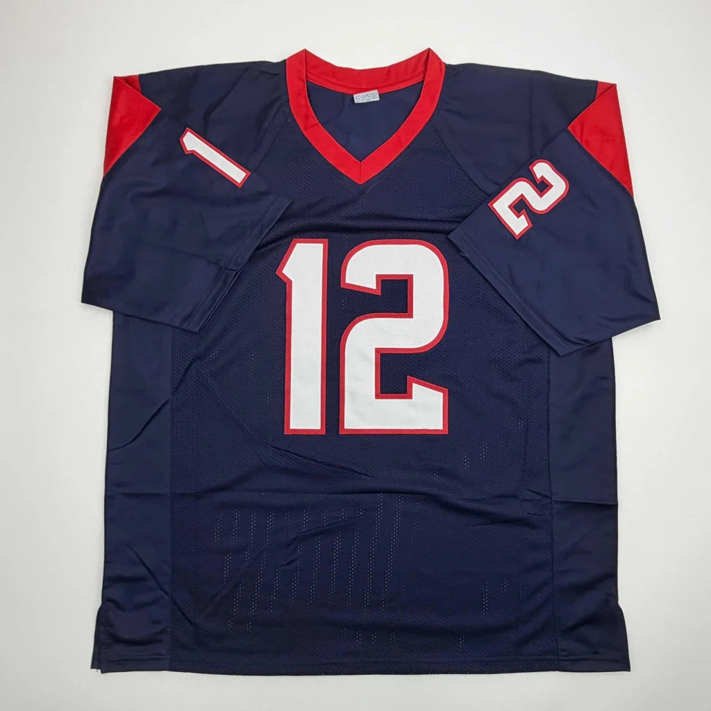 Navy blue custom jersey with red and white accents number 12 front signed by Nico Collins professional sports league rookie