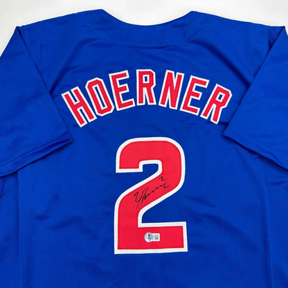 Autographed Nico Hoerner custom jersey in vibrant royal blue, Chicago professional sports league style