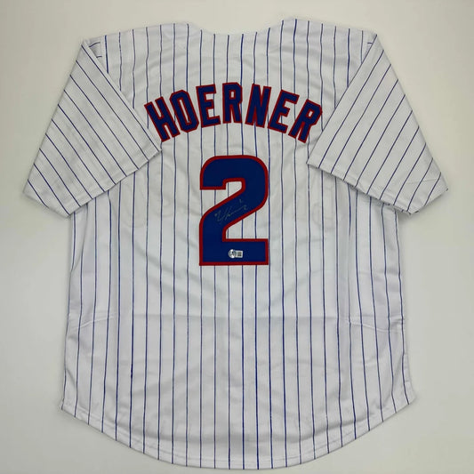 White custom jersey with blue pinstripes and large number 2 from professional sports league
