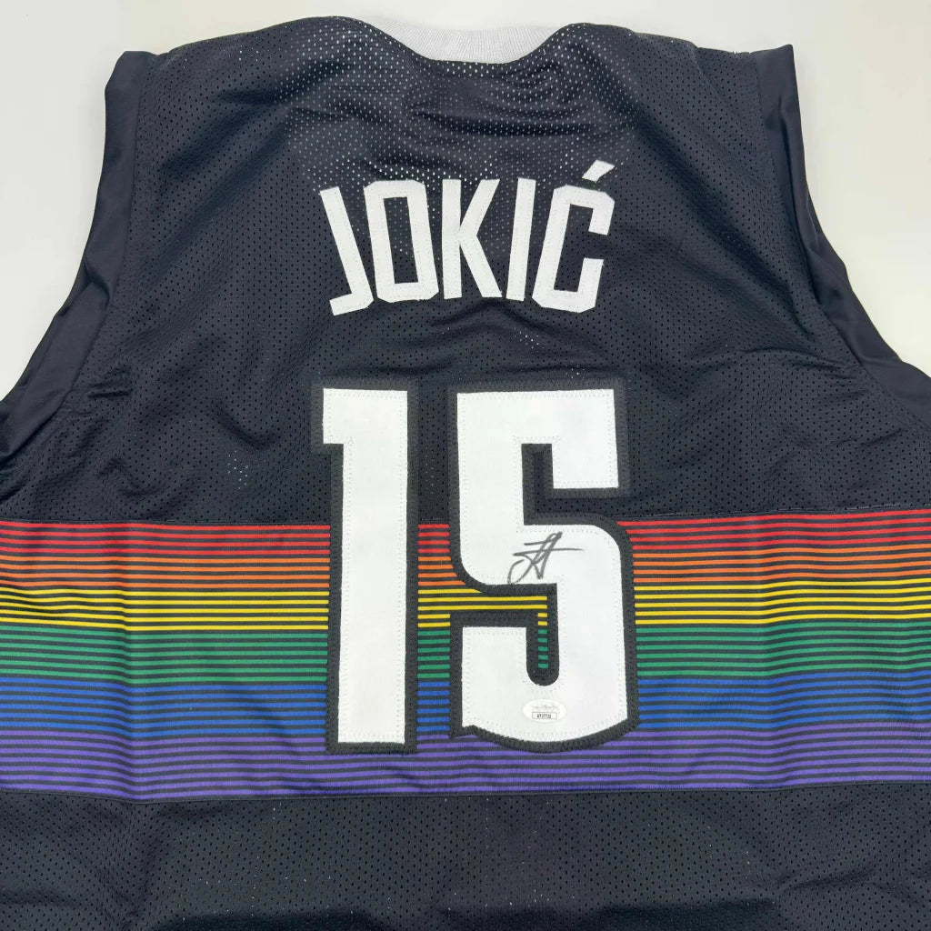 Signed Nikola Jokic Denver Black Rainbow Jersey with JOKIC 15 and rainbow stripes