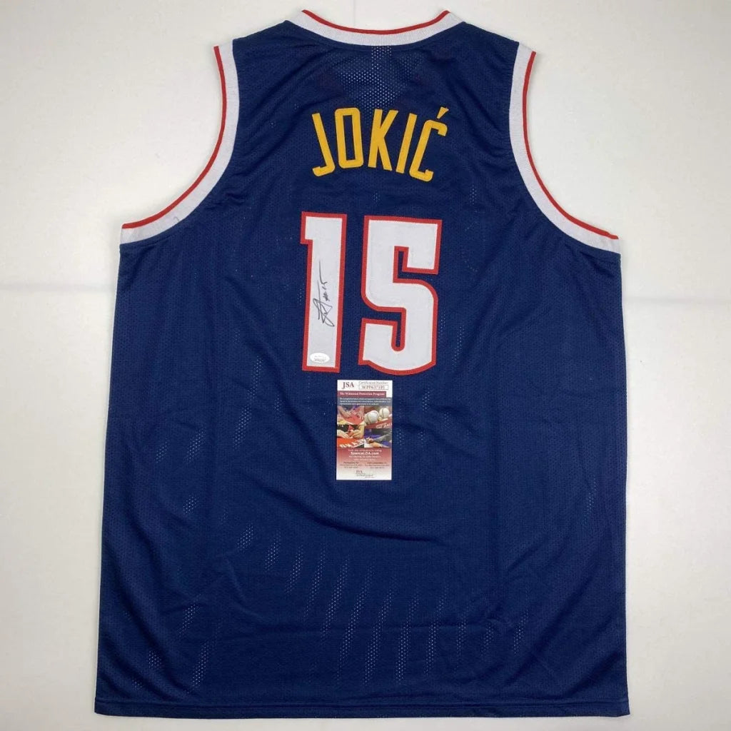 Autographed Nikola Jokic custom jersey in navy blue with yellow 15, red trim