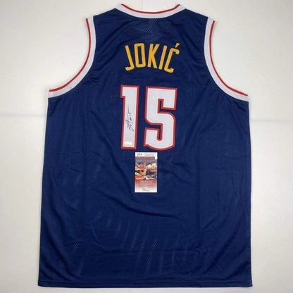 Autographed Nikola Jokic custom jersey in navy blue with yellow 15, red trim