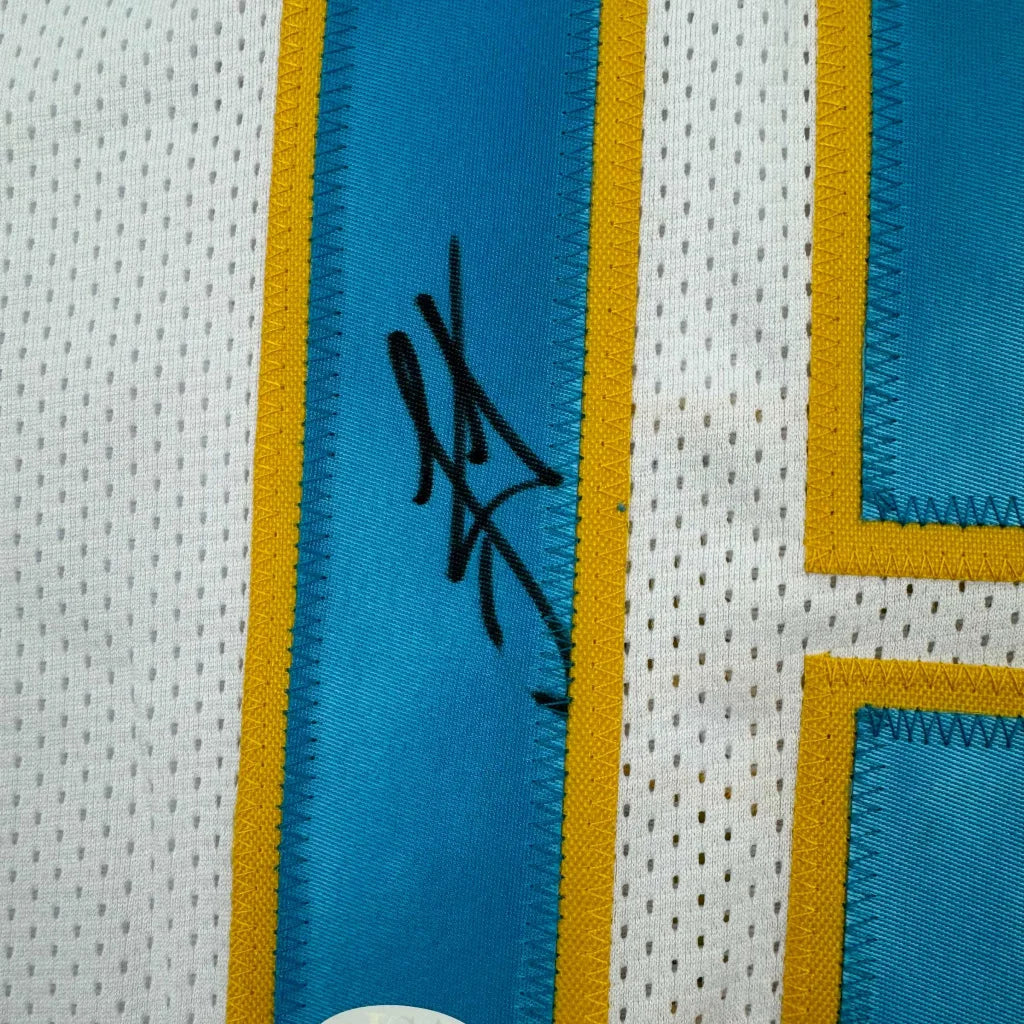 White and blue custom jersey signed by a pro athlete from a sports league for collectors