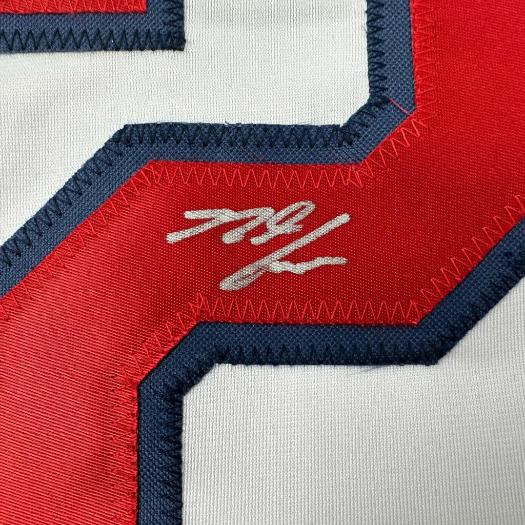 White custom jersey from Professional Sports League with red, blue stitching and silver signature