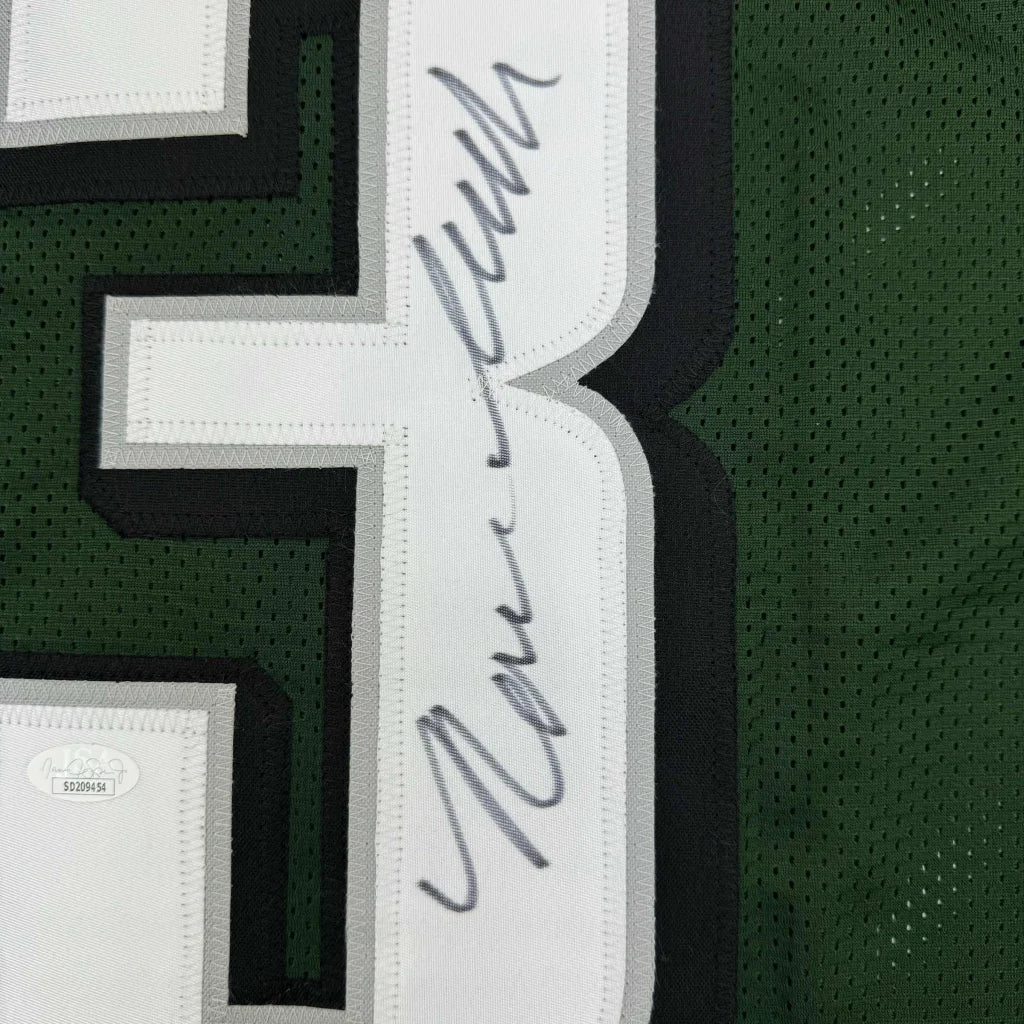 Autographed green custom jersey with white and black numbers for professional sports league