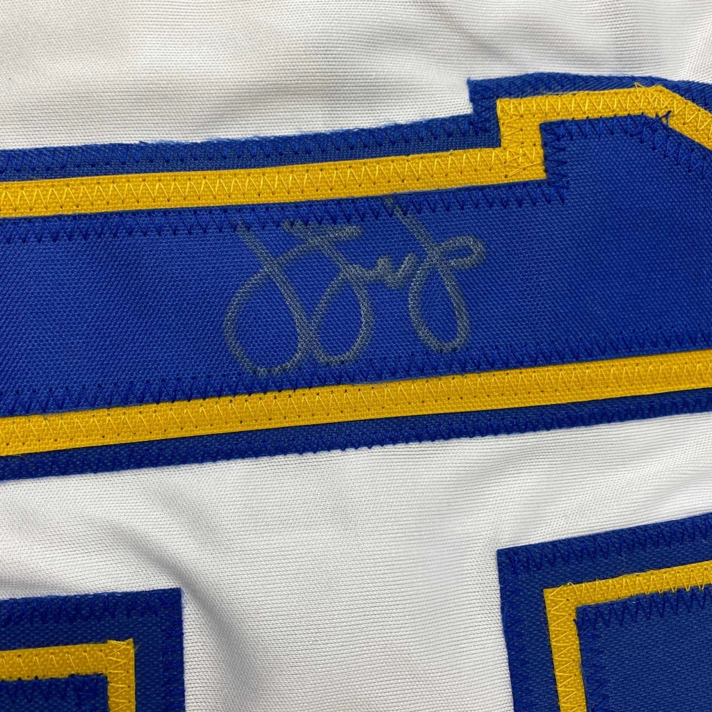 White and blue custom jersey with faded autograph from professional sports league