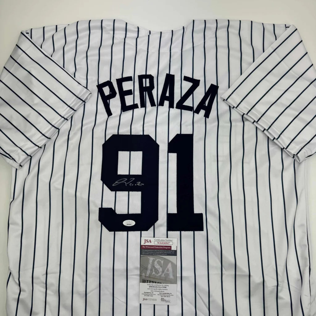 White pinstriped professional sports league jersey signed by PERAZA with 91 number