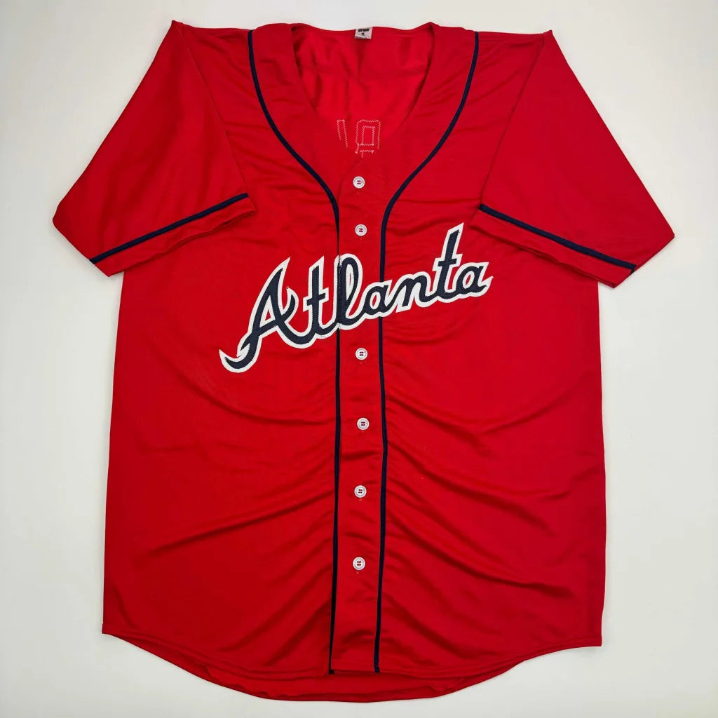 Red Atlanta jersey with Ozzie Albies signature and JSA COA authentication