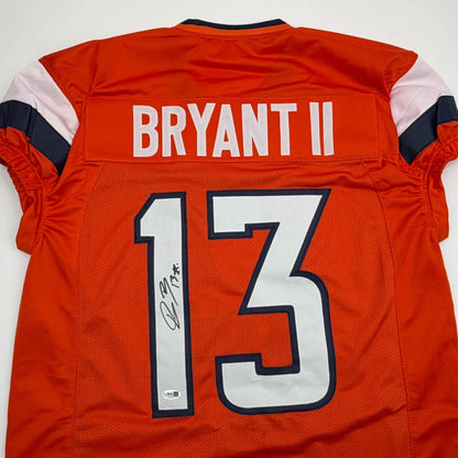 Signed orange Pat Bryant custom jersey with 13 and Bryant II, Denver Broncos NFL
