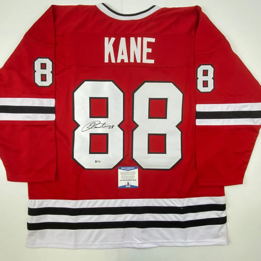 Red and white Patrick Kane Chicago custom jersey with number 88 and Beckett BAS autograph