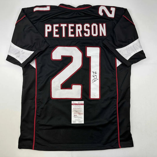 Black custom jersey with white numbers and red trim from Peterson 21 professional sports league