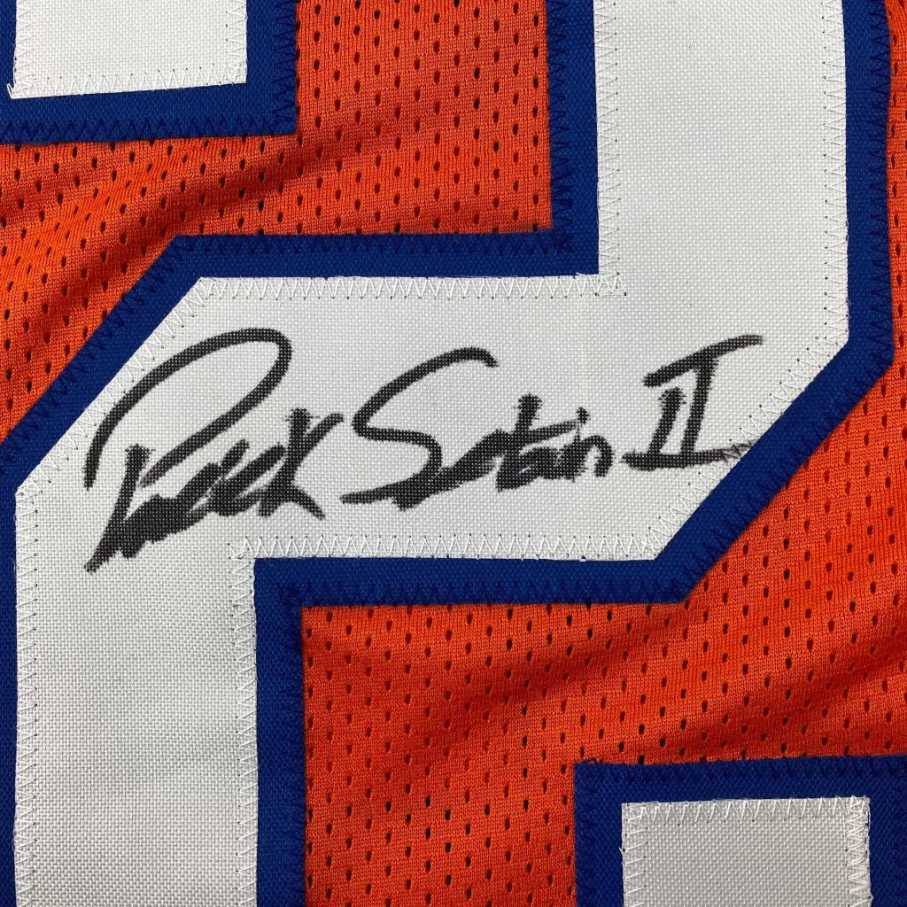 Orange and white mesh custom jersey with blue trim featuring an autographed signature from professional sports athlete patrick surtain ii