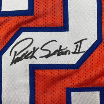Orange and white mesh custom jersey with blue trim featuring an autographed signature from professional sports athlete patrick surtain ii