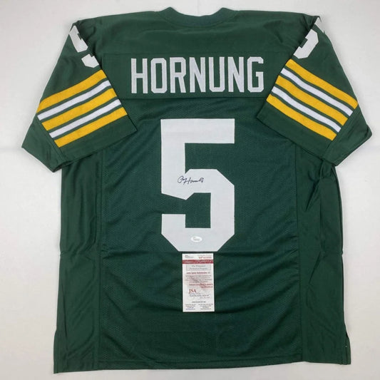 Back of custom green and yellow paul hornung green bay packers football jersey with white lettering and number 5 signed for professional sports league use