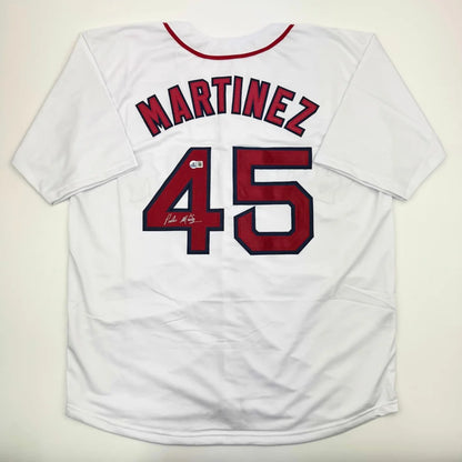 White baseball jersey with red trim and numbers from a professional sports custom jersey