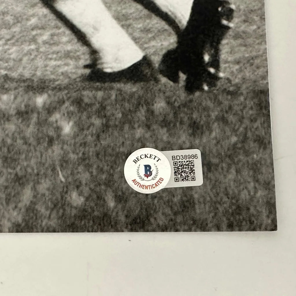 Black and white photo with authenticity stickers of Pelé’s signed bicycle kick shot
