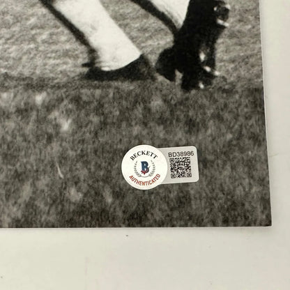 Black and white photo with authenticity stickers of Pelé’s signed bicycle kick shot
