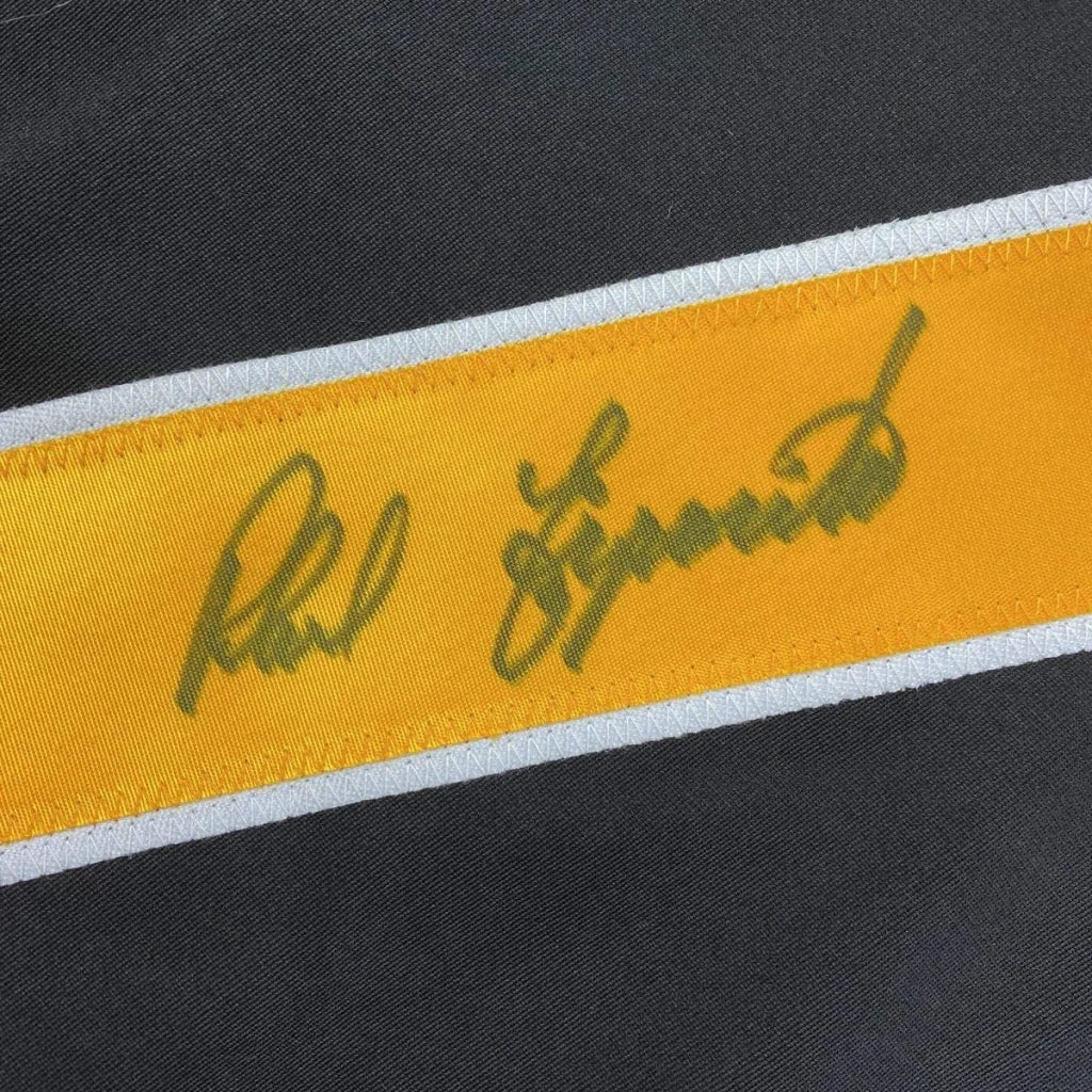 Black hockey jersey with vibrant yellow stripe and green phil esposito signature bordered by white trim for professional sports use