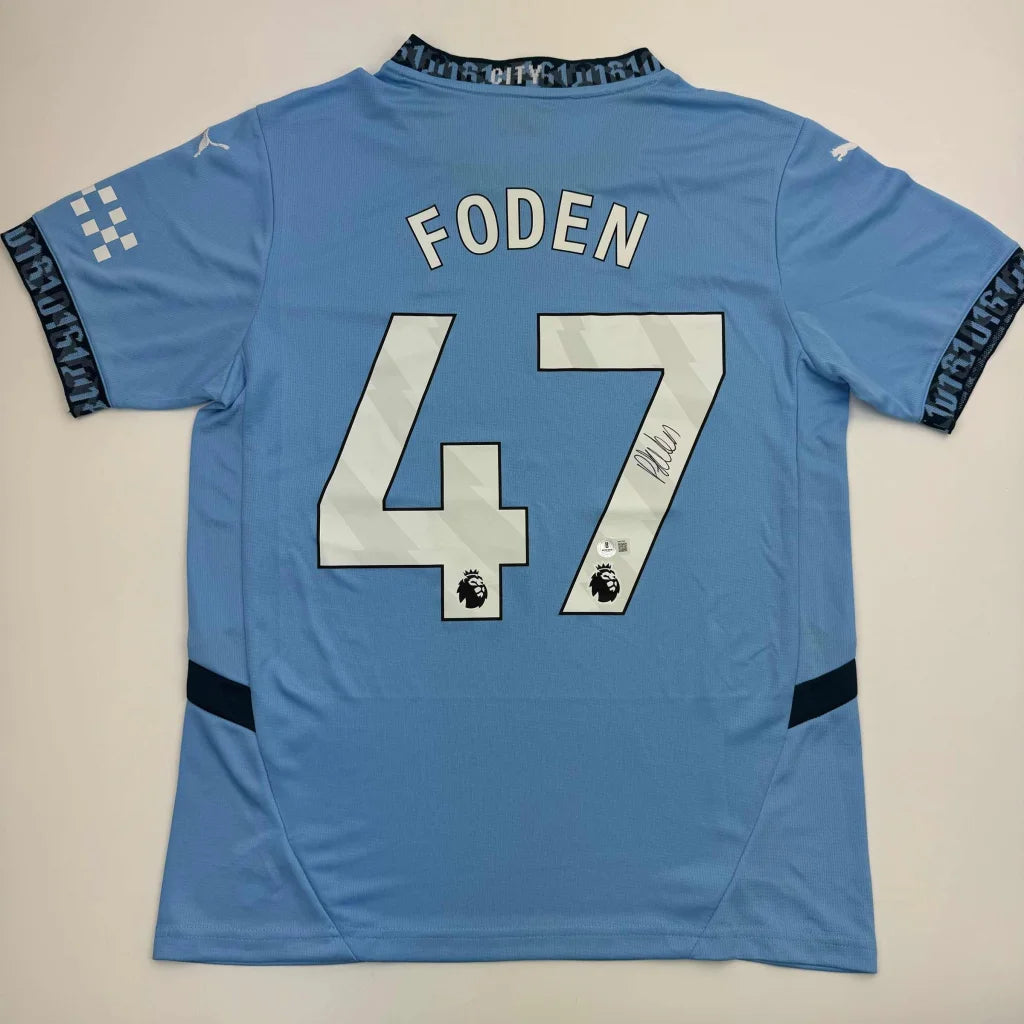 Light blue Manchester City jersey with Phil Foden 47 signature Beckett BAS display