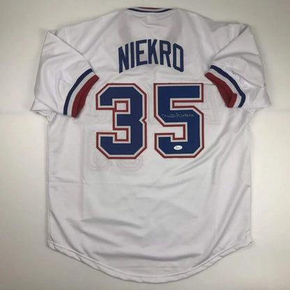 White custom jersey from professional sports legend Niekro with NIEKRO and 35 in blue and red