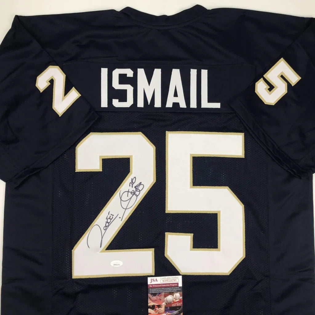 Dark blue custom jersey with white and gold numbers and autograph from Rocket Ismail