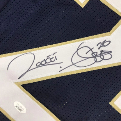 Autographed dark blue custom jersey with white and gold trim from Rocket Ismail, sports league collectible