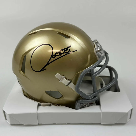 Gold mini football helmet with gray facemask and white chinstrap, third party authentication