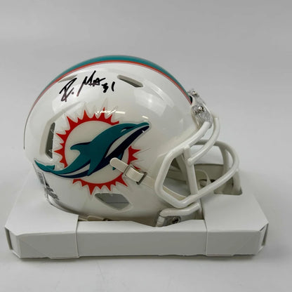 White Miami Dolphins mini football helmet with autograph in display case