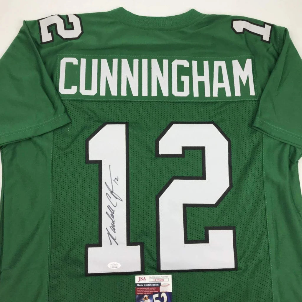 Green sports jersey with Cunningham and 12 autographed by Randall Cunningham for professional sports fans