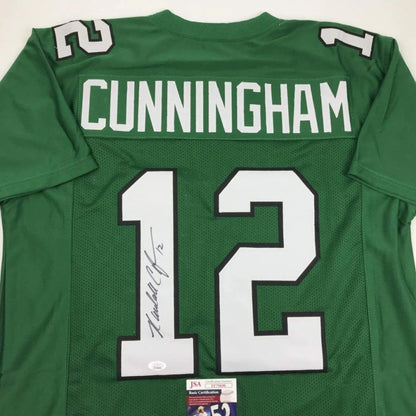 Green sports jersey with Cunningham and 12 autographed by Randall Cunningham for professional sports fans