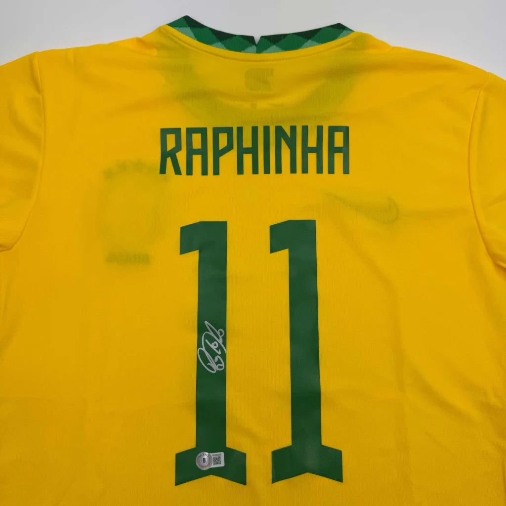 Bright yellow brazil national team custom jersey signed by raphinha with green lettering and number 11 back side view