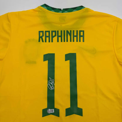 Bright yellow brazil national team custom jersey signed by raphinha with green lettering and number 11 back side view