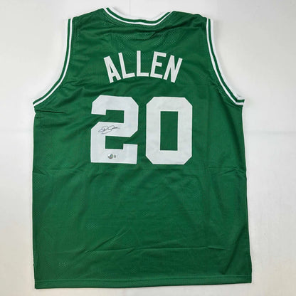 Green custom jersey from professional sports league with ALLEN 20 and signature display