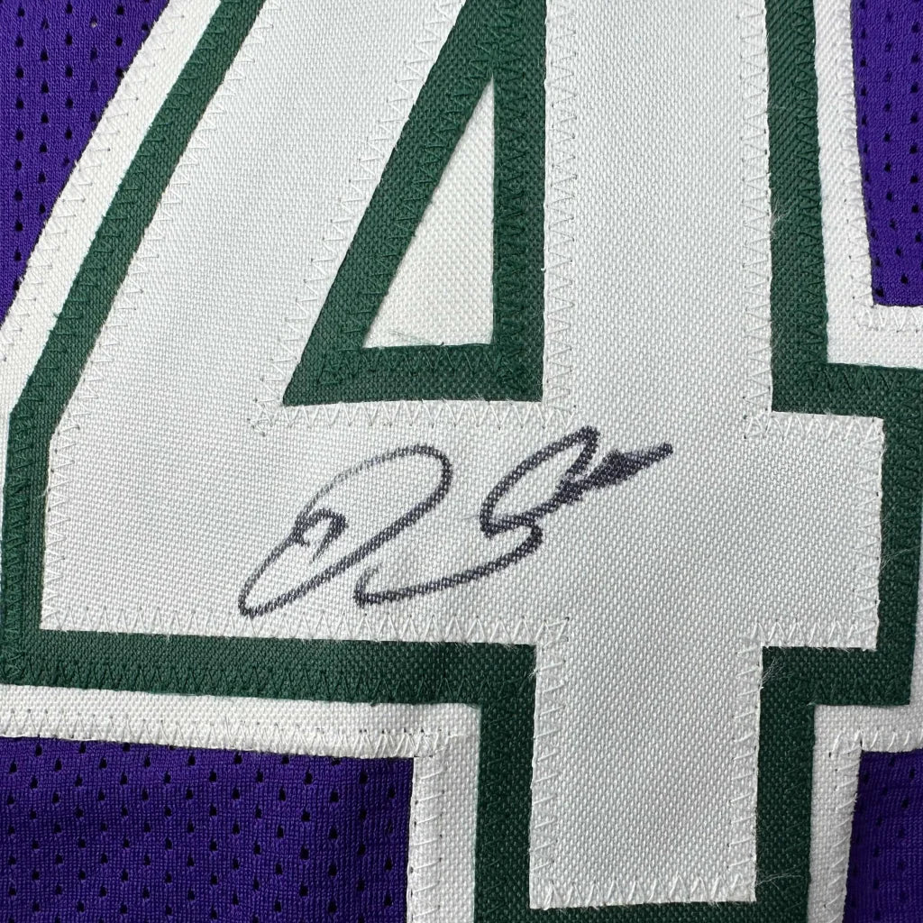 Autographed Ray Allen Milwaukee purple basketball jersey with white number four and green trim on mesh, Beckett BAS COA, custom professional sports league jersey